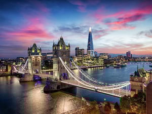 City skyline featuring a bridge over a body of water.