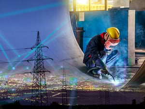 Power lines with manufacturing worker overlay.