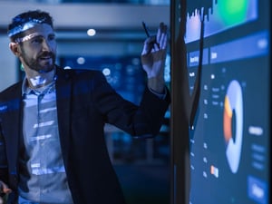 Man presenting chart.