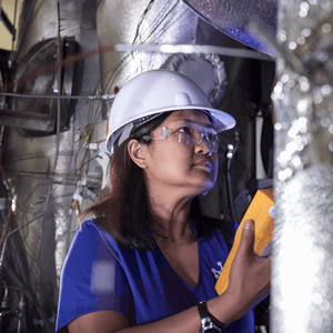 NuScale employee working in industrial setting. 